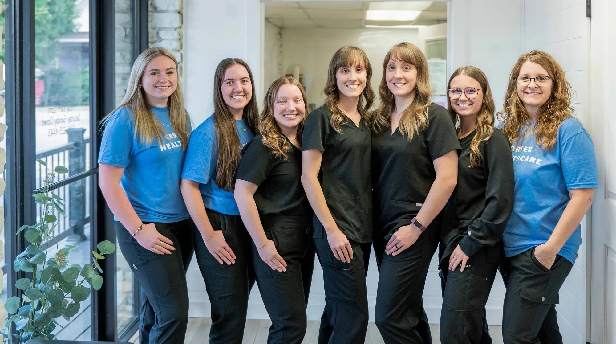 Carter Healthcare team lined up in clinic hallway